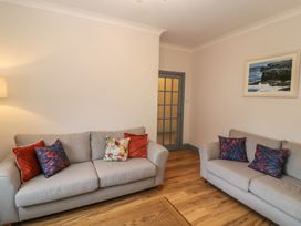 A living room with two sofas and a table at No 1 Lodge Wood Kenmare, County Kerry