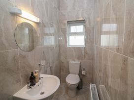 A bathroom with toilet and sink at No 1 Lodge Wood Kenmare, County Kerry