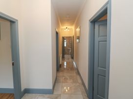 A hallway with doors and lights at No 1 Lodge Wood, Kenmare, County Kerry