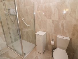 A bathroom with a shower and a toilet at No 1 Lodge Wood Kenmare, County Kerry
