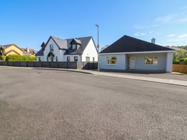 Two houses next to each other on a street at No 1 Lodge Wood, Kenmare, County Kerry