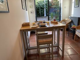 A dining room with a table set for breakfast at Old Town Cottage in Stratford-Upon-Avon