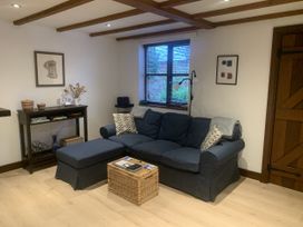 A living room with a sofa and coffee table at Old Town Cottage Stratford-Upon-Avon