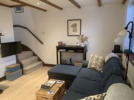 A living room with a sofa and coffee table at Old Town Cottage in Stratford-Upon-Avon
