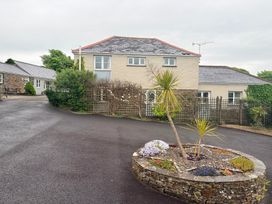 A house with a garden and paving at Sunlight Cottage St Erme near Truro