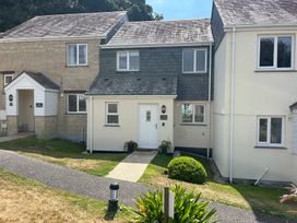 A house with a pathway and garden at Breeze Cottage in Falmouth
