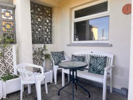 An outdoor seating area with chairs and a table at Merriview Ashton Nr Helston