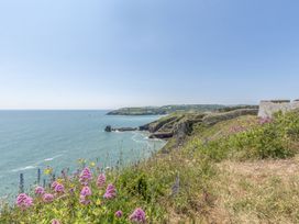 A coastal view with flowers and cliffs at Lodge 66 at Riviera Bay Coastal Retreat in Brixham