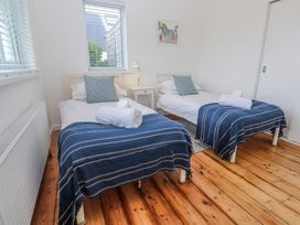 A bedroom with two beds and a nightstand at Bod A Quinte in Carbis Bay