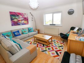 A living room with a couch and coffee table at 15 Lawnswood in Saundersfoot