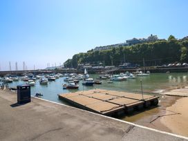 A marina with boats and a dock at 15 Lawnswood in Saundersfoot
