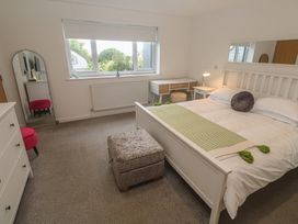 A bedroom with a bed and desk at Chy Holly in Carbis Bay