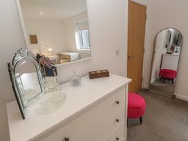 A bedroom with a dressing table and stool at Chy Holly in Carbis Bay