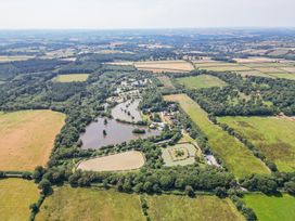 An aerial view of a property with ponds and fields at Silver Birch in Dolton