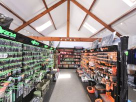A fishing tackle store with shelves of products at Maple in Dolton