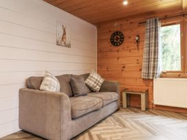 A living room with a sofa and a window at Willow in Dolton