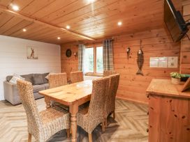 A dining room with a table and chairs at Willow in Dolton