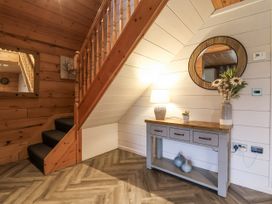 An entrance area with a staircase and a console table at Willow in Dolton