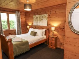 A bedroom with a bed and bedside table at Willow in Dolton