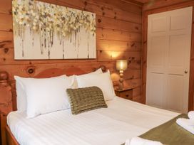 A bedroom with a bed and a lamp at Willow in Dolton