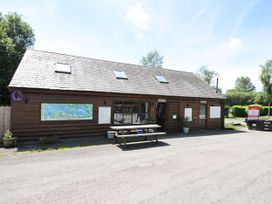 A wooden building with a table and map at Willow in Dolton