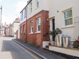 An outdoor area with a house and plant pots at 5 Exe Street Topsham