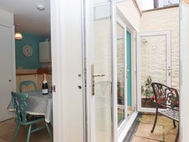 A dining room with a table and chairs at 5 Exe Street Topsham