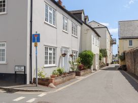 A street view with buildings and planters at 5 Exe Street Topsham