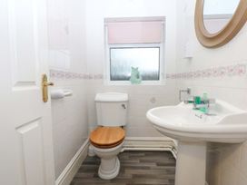 A bathroom with a toilet and sink at Southbourne Manor in Llandudno
