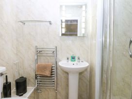 A bathroom with a sink and shower at Southbourne Manor in Llandudno