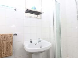 A bathroom with a sink and shower at Southbourne Manor Llandudno