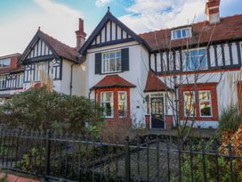 A house with a garden and fence at Southbourne Manor in Llandudno