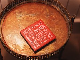A coaster on a table at Glanllyn Bach in Llanfaelog