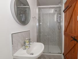 A bathroom with a sink and shower at Tan Y Merddyn in Ceunant near Llanrug