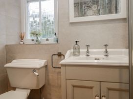 A bathroom with a sink and toilet at The Thistles in Bowness-On-Windermere