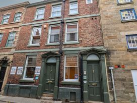A building facade with doors and windows at Jolly Roger in Whitby
