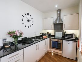 A kitchen with a sink and appliances at Jolly Roger in Whitby
