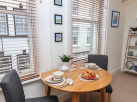A dining room with a table set for breakfast at Jolly Roger in Whitby