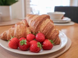 Croissants and strawberries on a plate
