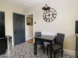 A dining room with a table and chairs at 5 Thornbarrow Road 