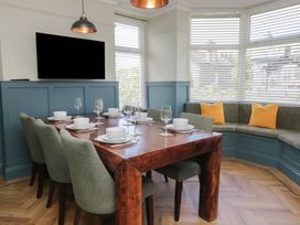 A dining room with a table and chairs at 5 Thornbarrow Road