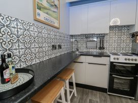 A kitchen with counter space and appliances at Estuary Escape in Porthmadog