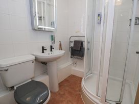 A bathroom with a sink and shower at Estuary Escape in Porthmadog