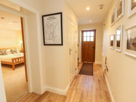 A hallway with a door and a map at Deer Wood At Applethwaite Hall in Windermere