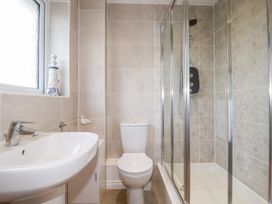 A bathroom with a shower, toilet, and sink at Blissful Ocean Breeze in Perranporth