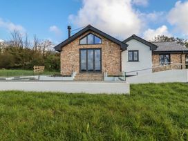 A house with windows and stairs at Lake View in Kestle Mill near Quintrell Downs