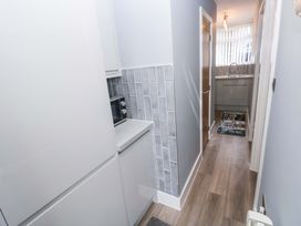 A kitchen with cabinets and sink at 3 Devon Court Pembroke
