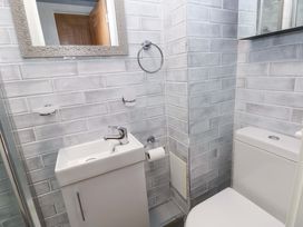 A bathroom with a sink and a toilet at 3 Devon Court in Pembroke