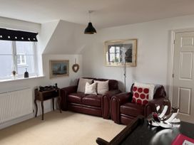 A living room with a sofa and chair at 20 Keay Heights St Austell
