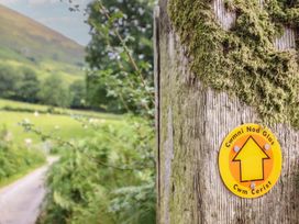 A signpost indicating the path at Cwm Nod Glas in Dinas Mawddwy near Dolgellau
